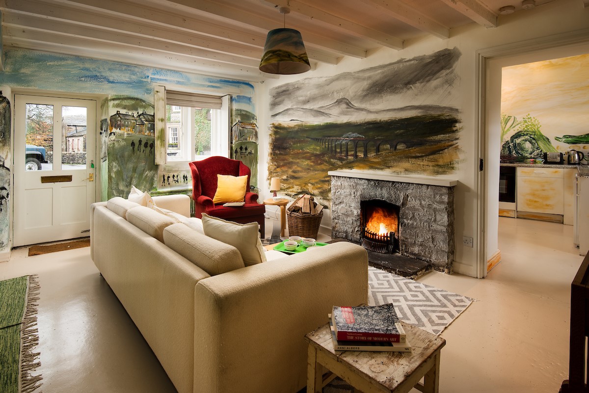 The Art House - the lounge area with an open fire at its heart