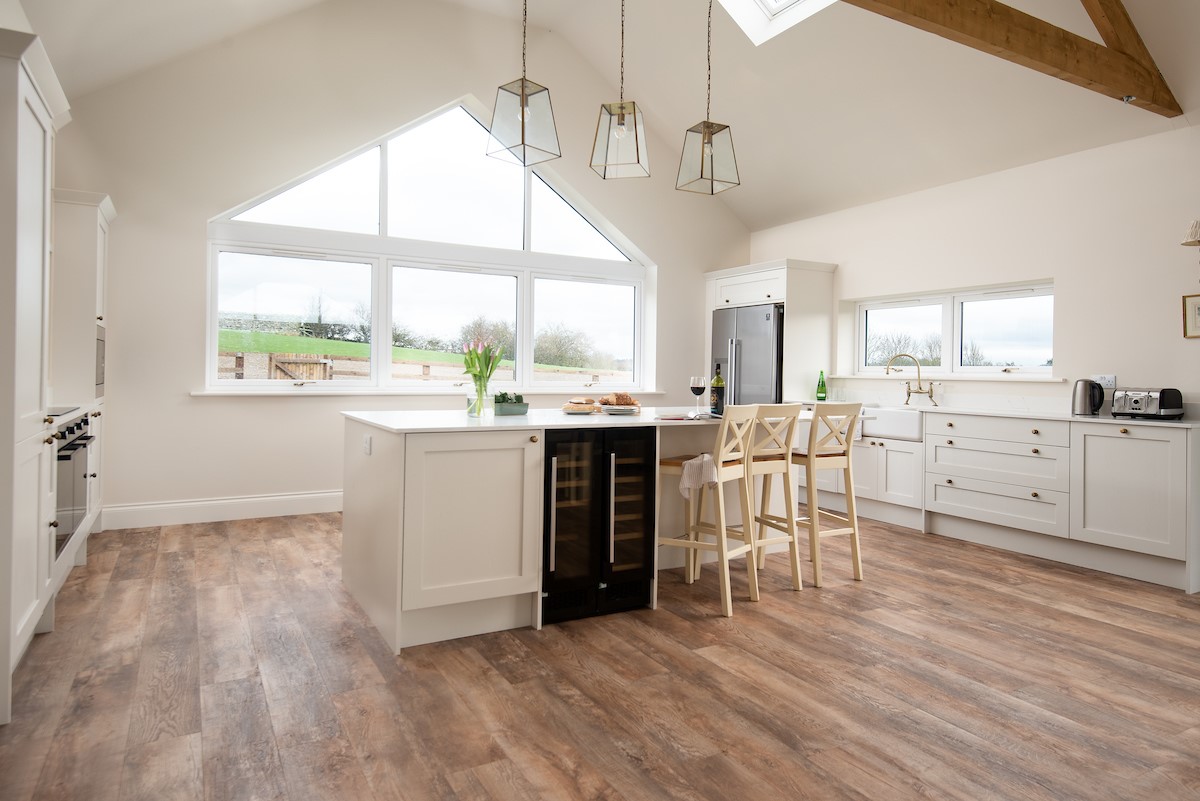 Riverhill Cottage - large kitchen island with seating and wine cooler