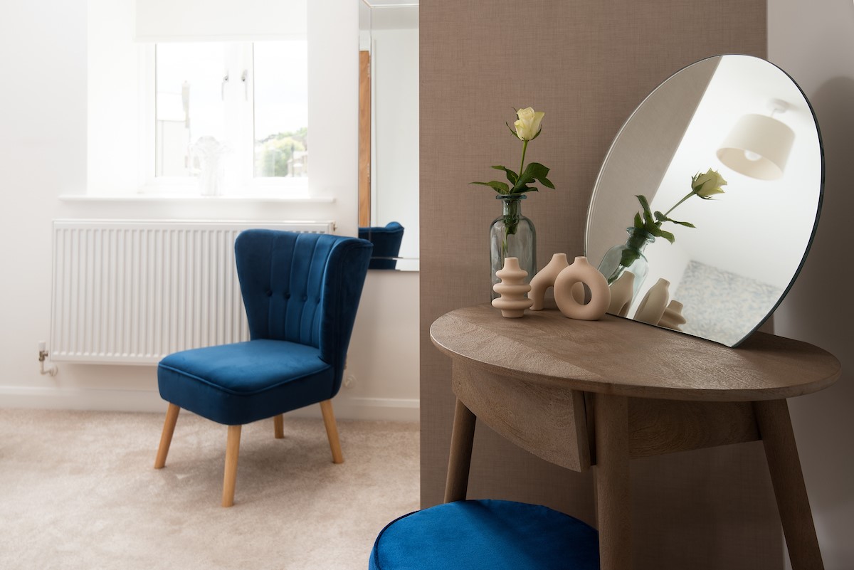 The Barley Loft - accent chair and dressing table with mirror in bedroom one