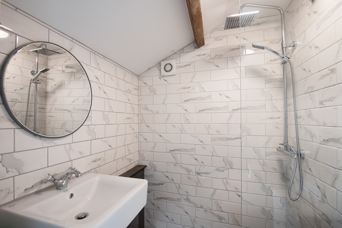 Castle View, Bamburgh - the ground floor shower room, located off the utility room and rear access