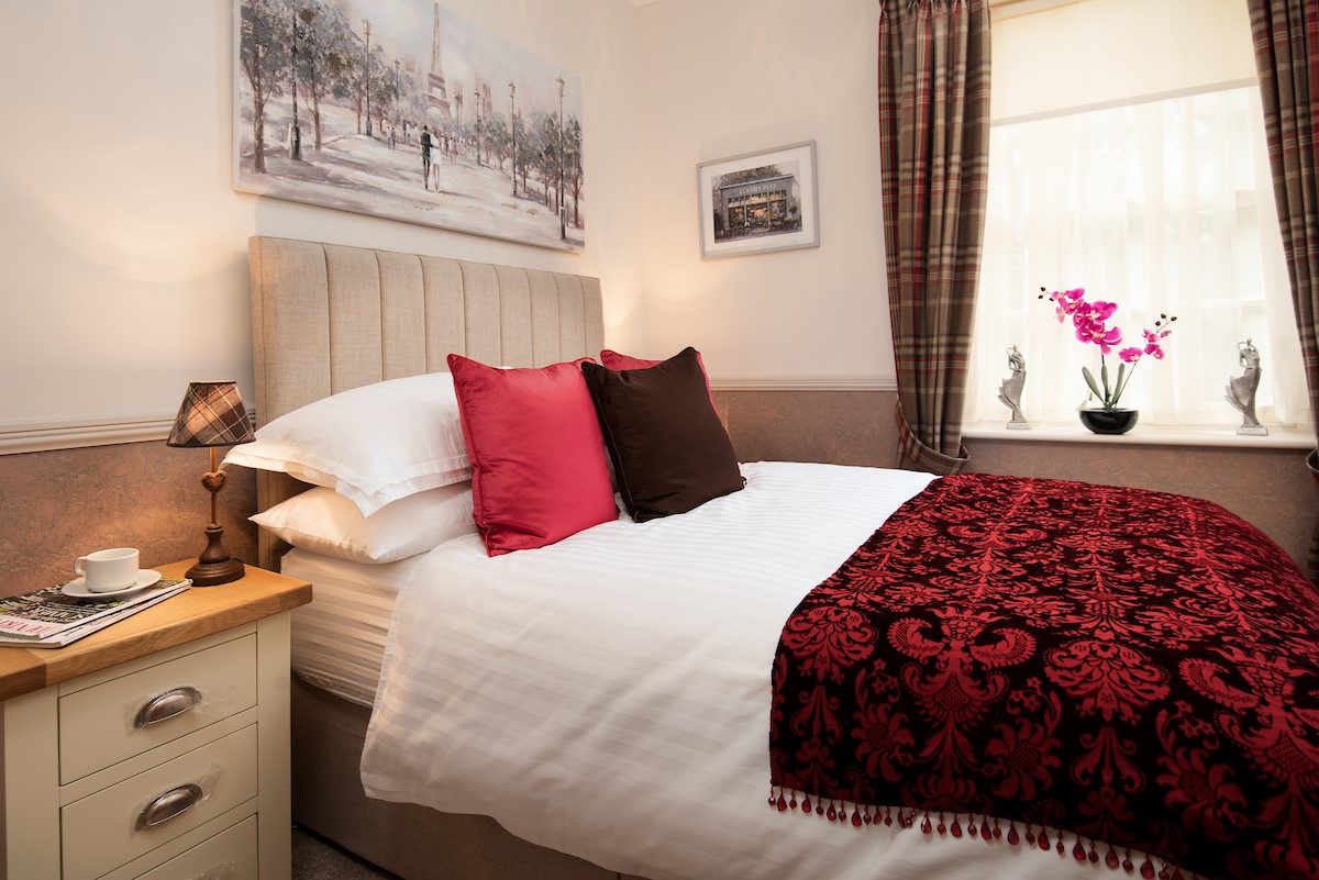 Bank View - bedroom two with double bed and crisp white linen sheets