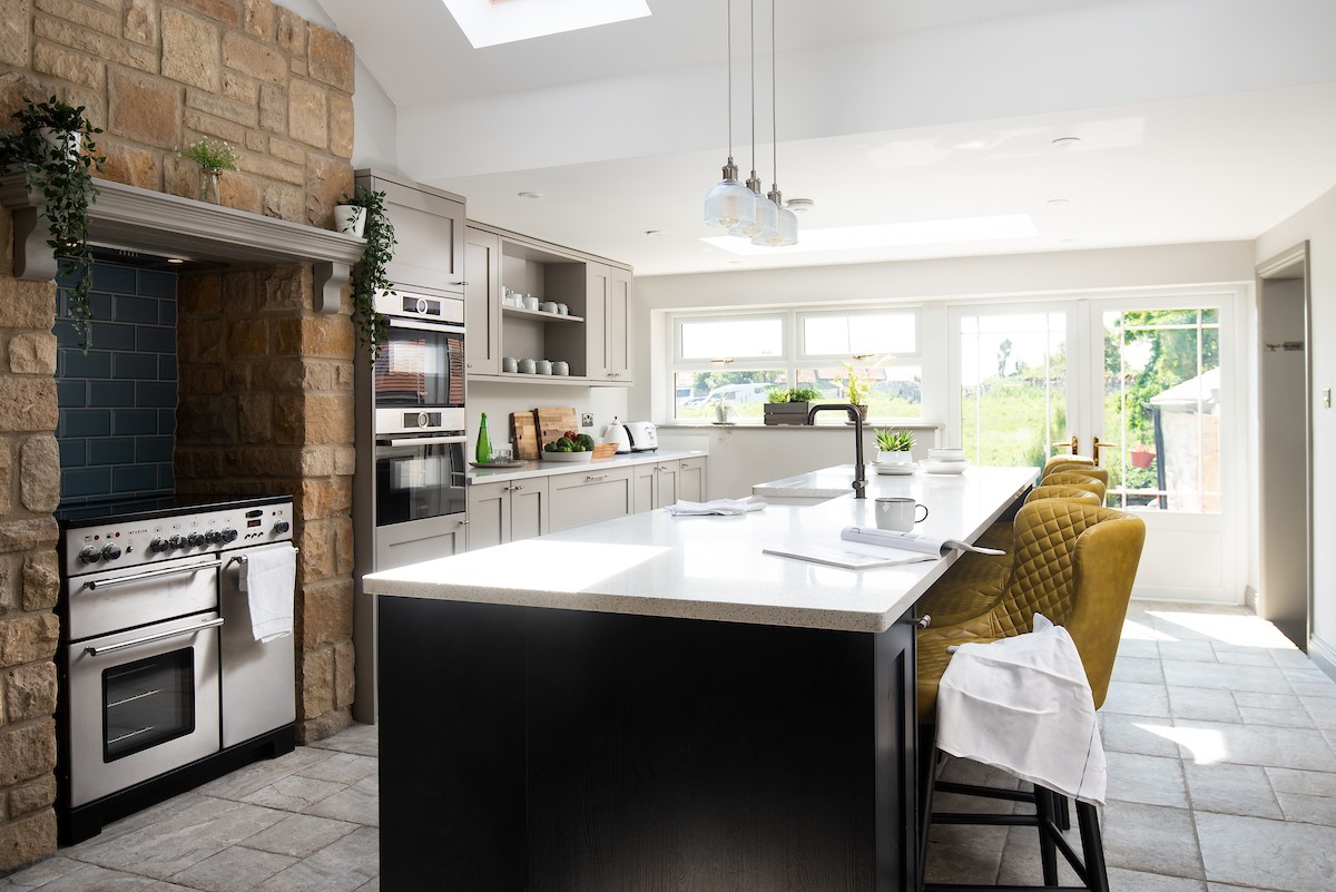 Castle View, Bamburgh - well equipped shaker style kitchen with infusion range cooker and large kitchen island