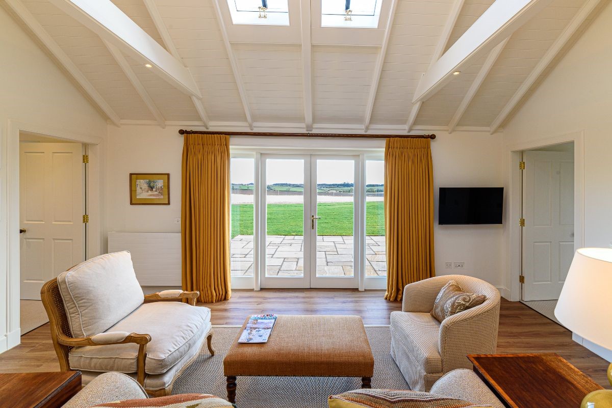 Fenton Lodge - living area with great views out of the French doors