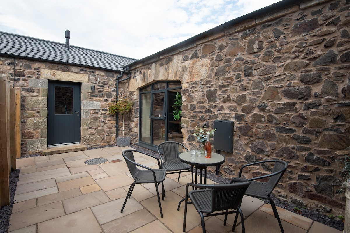 The Old Byre at West Moneylaws - outdoor dining furniture on the patio