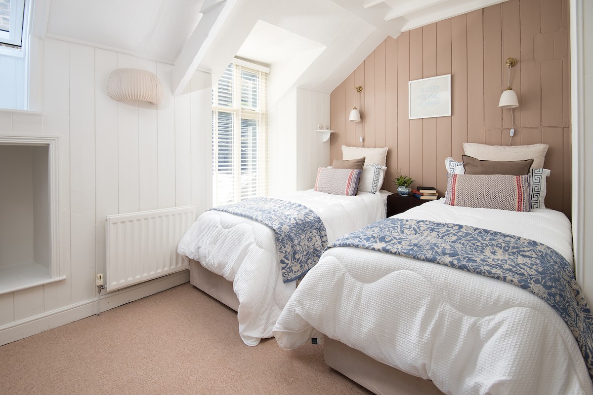 Marine House Cottage - bedroom two with fixed twin beds and bedside tables
