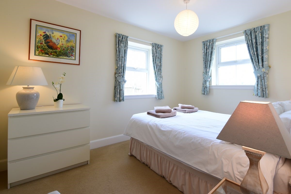 Hawthorn House -  bedroom three with double bedroom and chest of drawers for storage
