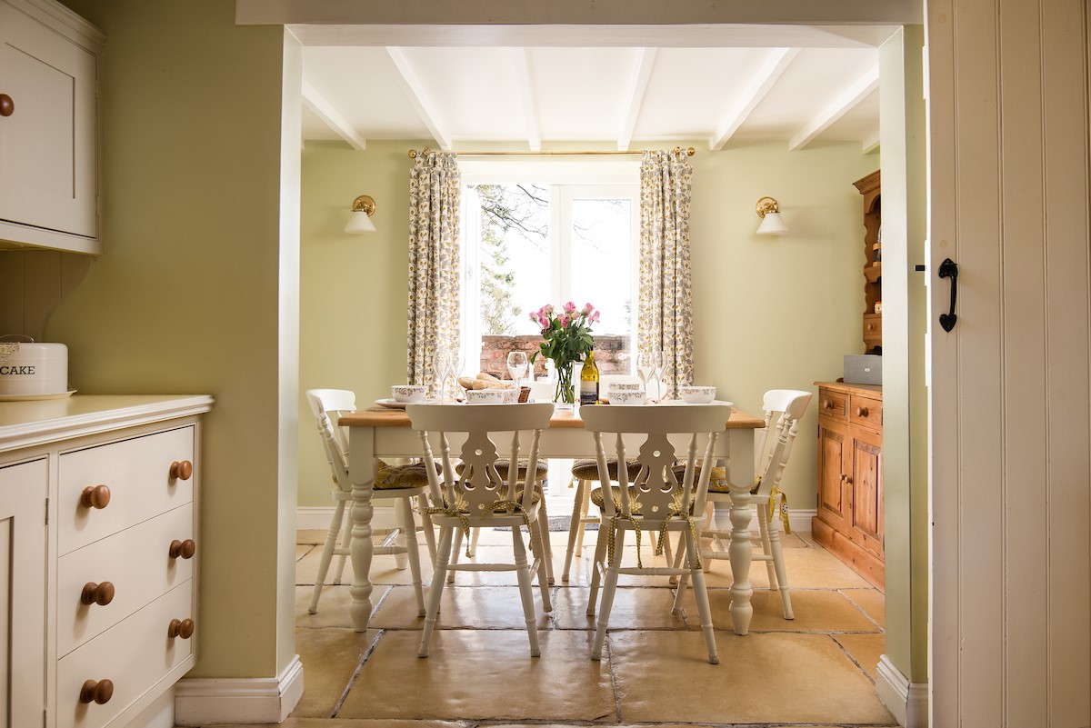 Rose Cottage, Huggate - the dining area with access through to the side courtyard