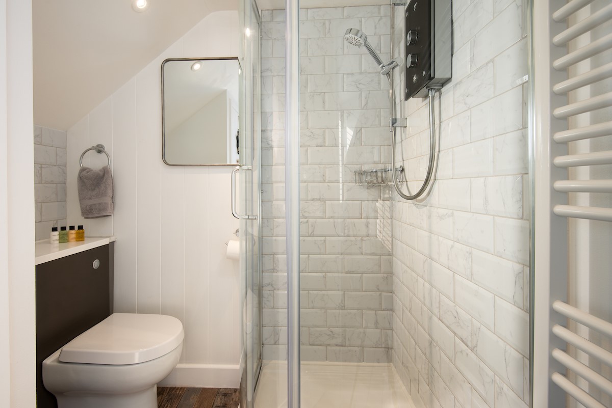 The Arch - bedroom one en-suite shower room with large shower, basin and WC