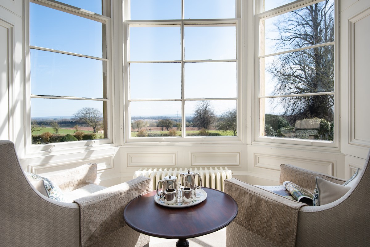 Cairnbank House - the large bay window floods the room with natural light and offers commanding views over the local countryside