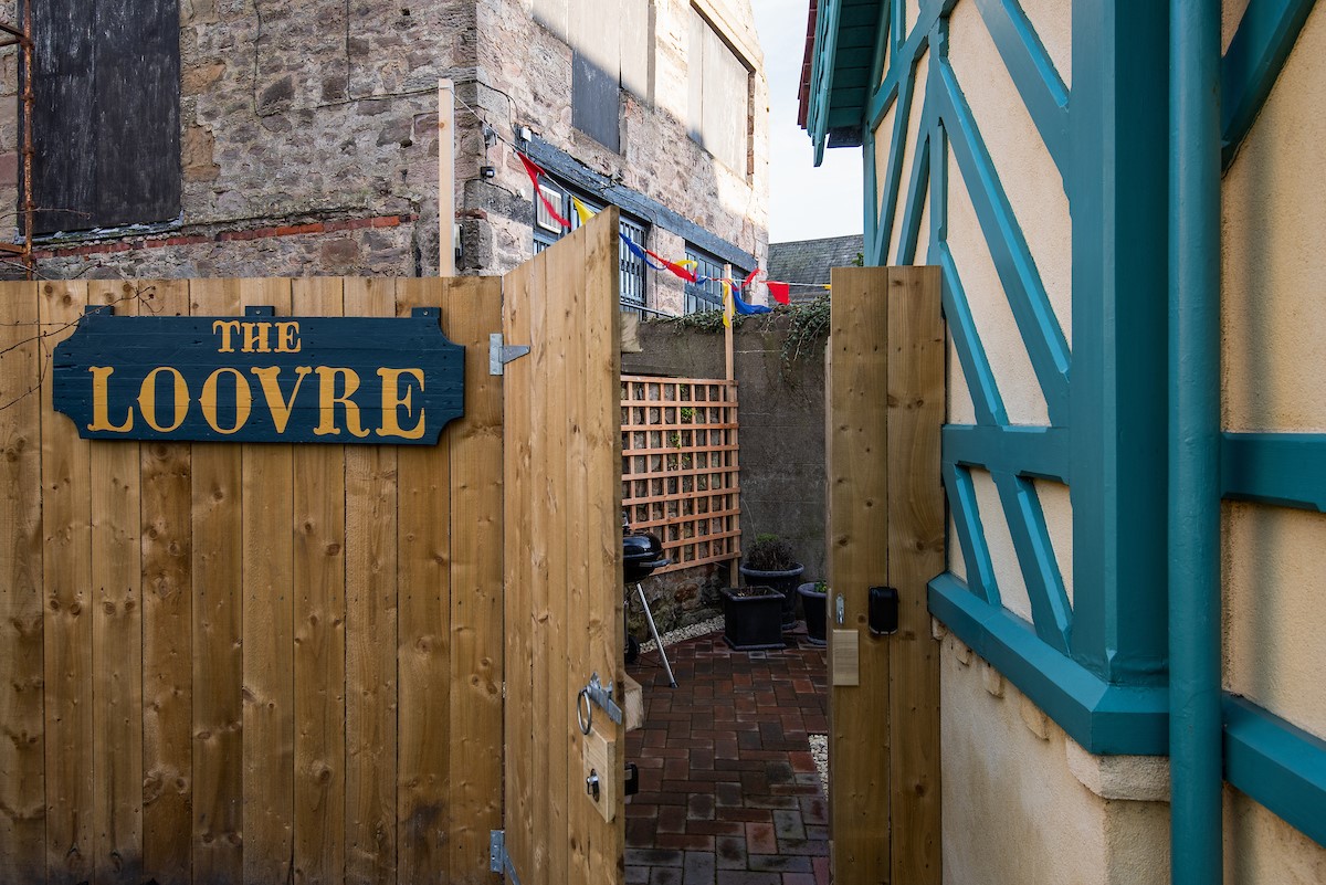 The Loovre - leading to the courtyard at the rear, which can be used as a secure spot to store bicyles and outdoor kit
