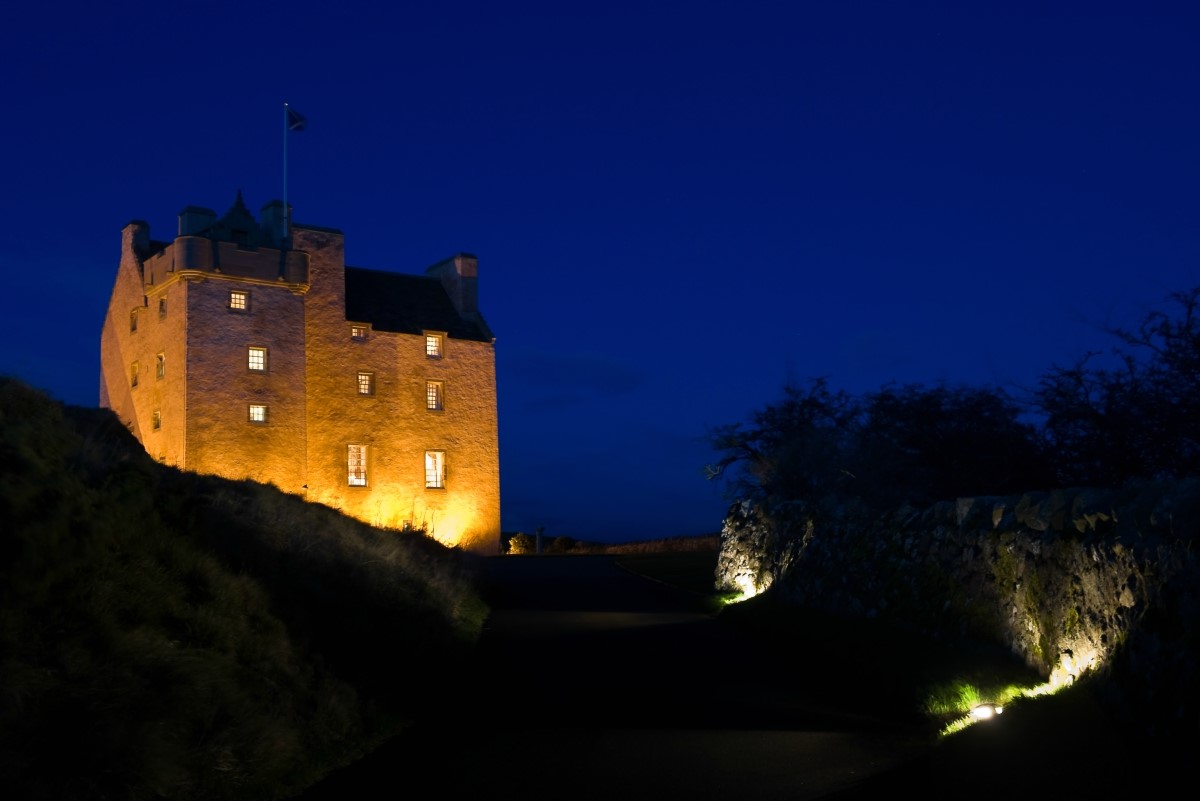 Fenton Tower in East Lothian - set against a dramatic night sky