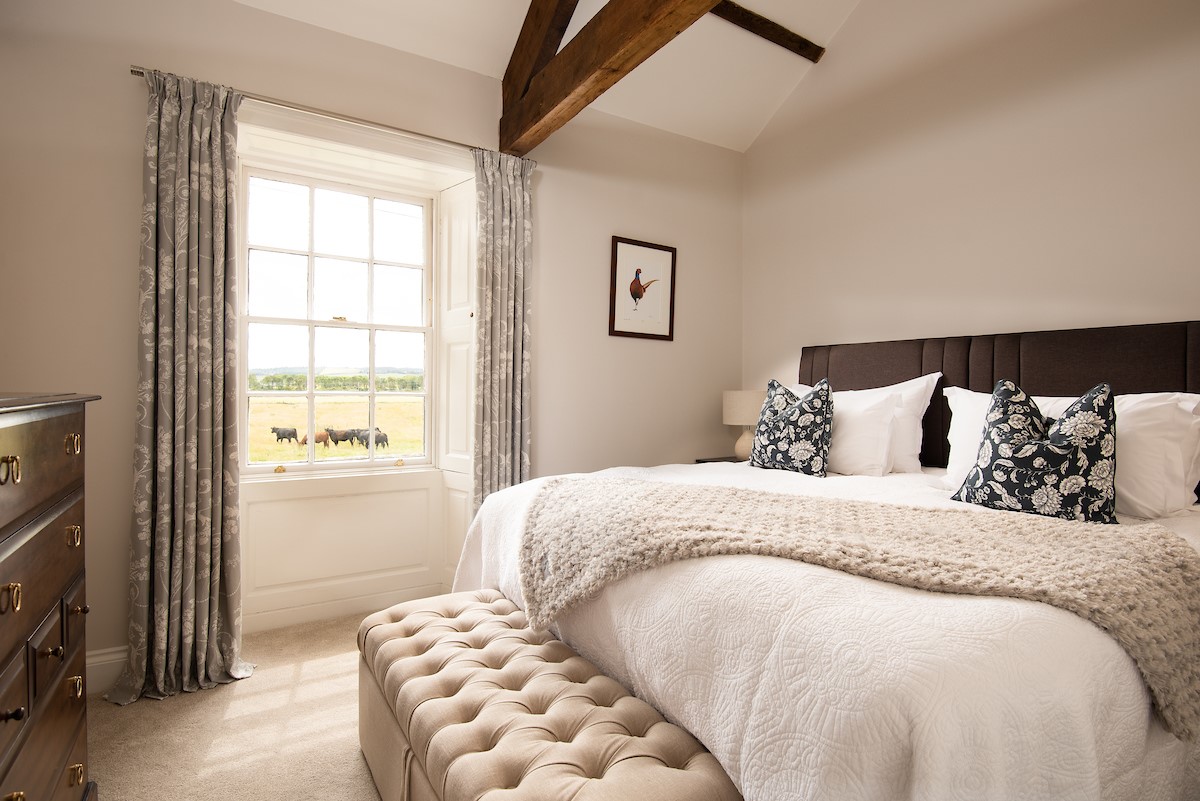 Brockmill Farmhouse - bedroom six with zip and link beds, exposed beams and large south-facing windows with original shutters