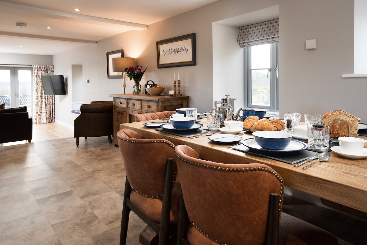 The Granary at Rothley East Shield - dining table overlooking the living area