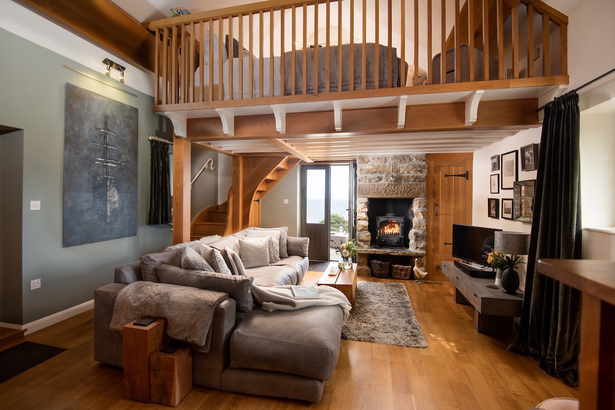 Bay View Cottage - the stylish open plan living area with mezzanine floor above