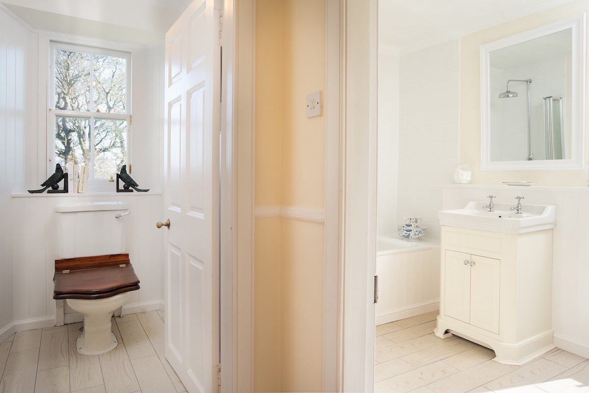 The Tower, Keith Marischal - bathroom three featuring a bath with shower over and separate WC