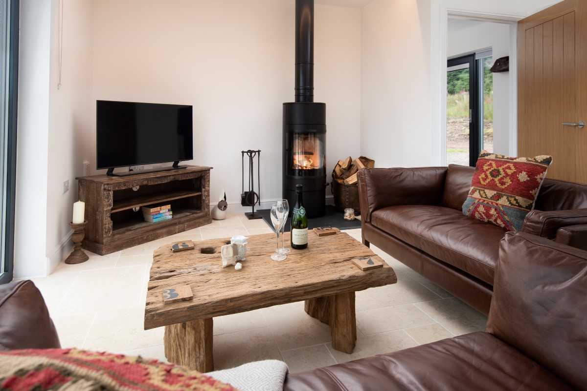 The Maple - unwind in the cosy seating area infront of the tv and wood burning stove