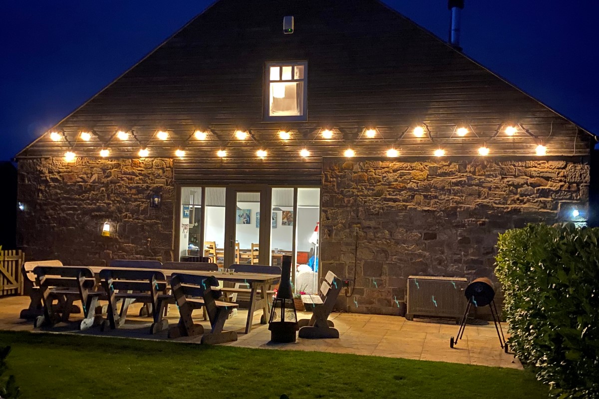 Moo House - festoon lighting allowing guests to enjoy late evening dining outdoors