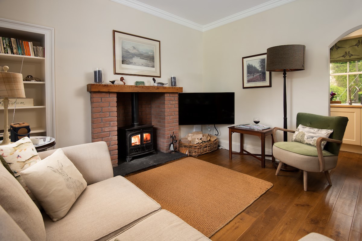 Pentland Cottage - the cosy sitting room with wood-burning stove