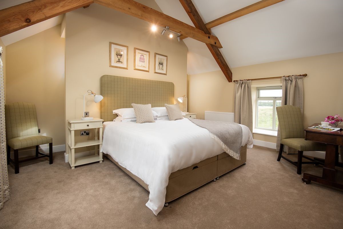 The Granary - bedroom two with beams