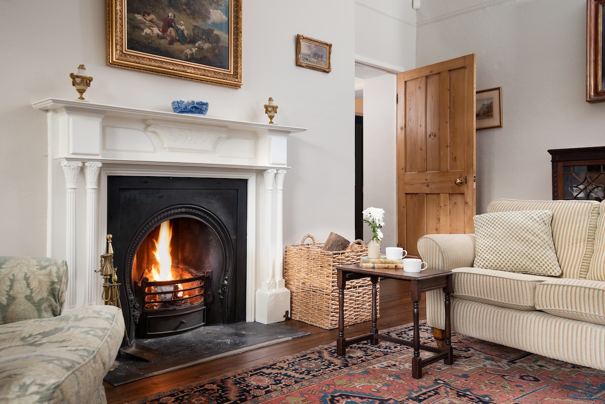 The Old Vicarage - the warmth of an open fire in the drawing room - please note some cosmetic changes are being made - new images available March