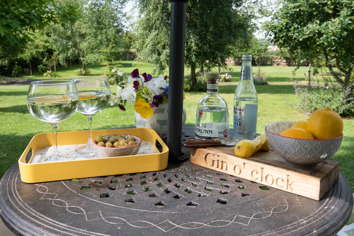 The Showman's Wagon - outdoor dining area where guests can enjoy a gin & tonic in the sun