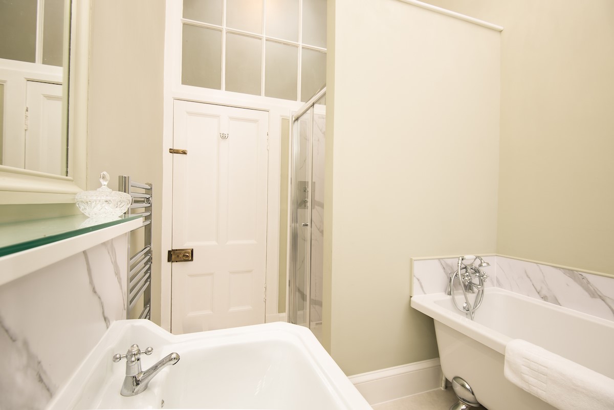 The Linen House - first floor bathroom featuring a slipper bath and walk-in shower