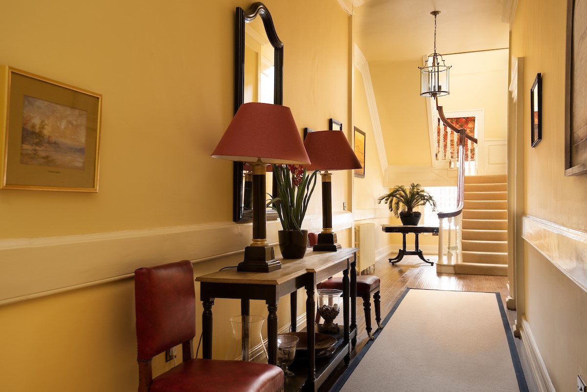 Eslington East Wing - inviting hallways with large staircase leading to the upper floor