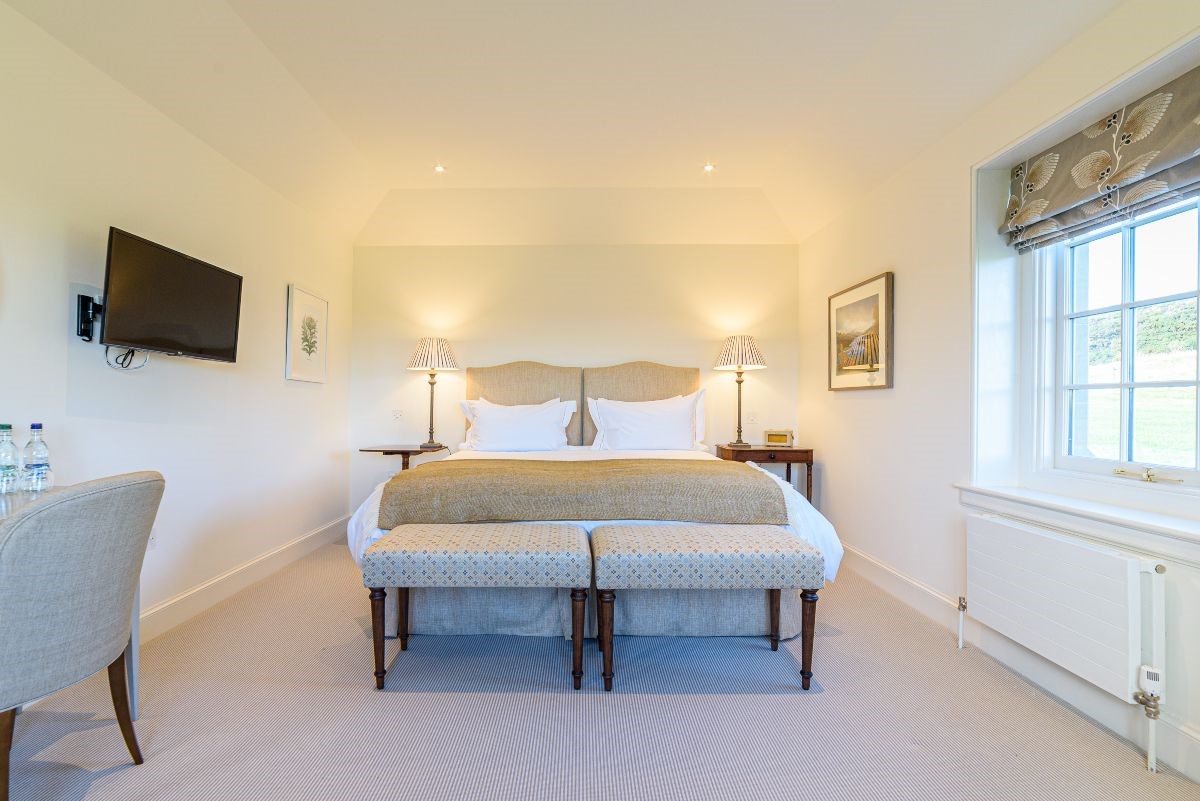 Fenton Lodge - North bedroom with zip and link beds, side tables, TV and dressing table