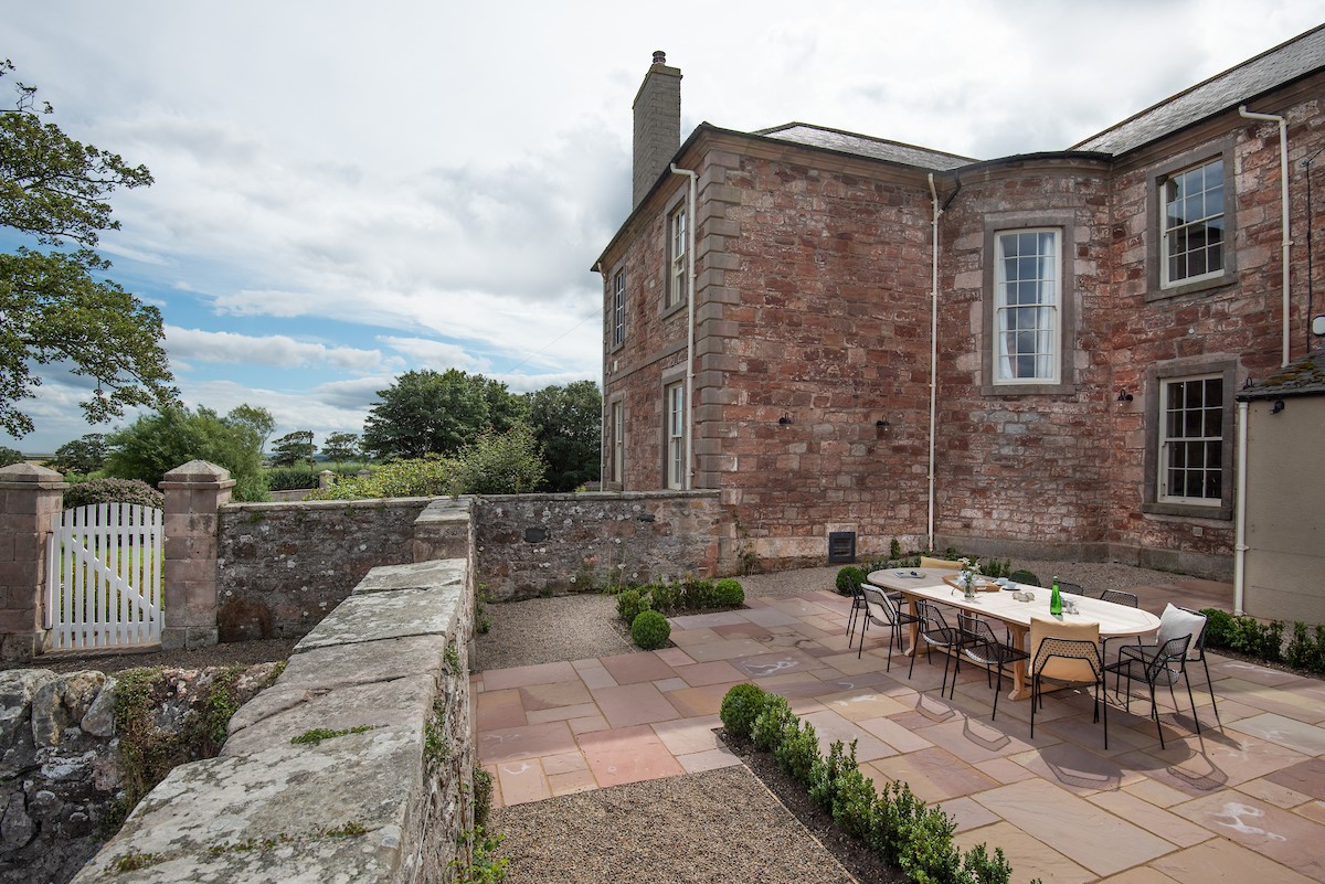 East House - the well-presented courtyard area with seating for twelve guests