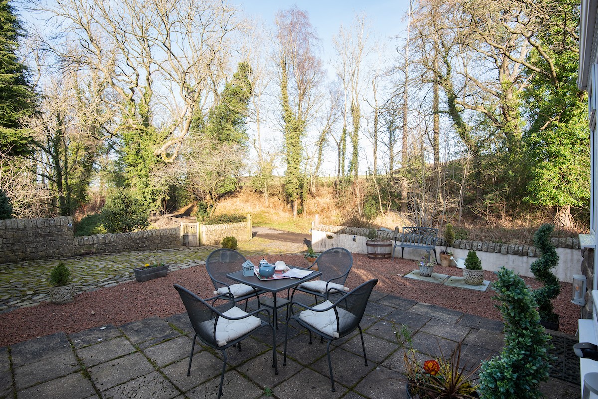 The Old Paper Mill - courtyard garden with outdoor dining table, ideal for alfresco dining