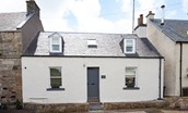 Campsie Cottage - a whitewashed semi-detached cottage in the pretty village of Ancrum