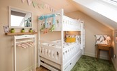 Goose Cottage - bedroom three with full-size bunk beds and miniature clothing rail