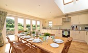Hawthorn House - bright and airy kitchen with large bi-fold doors out to the garden and skylight