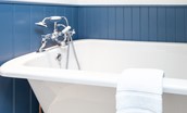 The Wheel House - en suite bathroom with roll top bath and hand held mixer