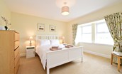 Hawthorn House - bedroom two with king size bed and large double window with views of the surrounding fields