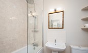 Berryburn Cottage - en-suite bathroom with bath and shower over