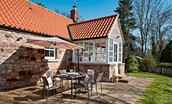 Berryburn Cottage - sunny patio area with garden furniture