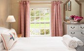Aydon Castle Cottage - bedroom two with views into the garden