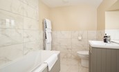 Aydon Castle Cottage - family bathroom with bath and shower over