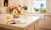 Brunton House - kitchen island, double Belfast sinks with view overlooking Northumbrian countryside