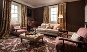 Broadgate House - cosy sitting room with sofa and armchairs