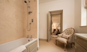 Broadgate House - bedroom one en-suite bathroom with bath with shower over, WC and basin