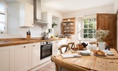 Garden House - kitchen with dual aspect views and dining table with seating for six