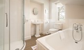 Tweedside - ground floor bathroom with bath and corner shower