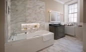 Glenburnie - bathroom with bath and shower over, basin, vanity unit and WC