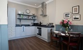 Glenburnie - stylish kitchen and dining area seating two guests