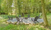Bellshill Bothy - idyllic outdoor seating area in the woods within the garden complete with firepit