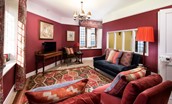 The Clock Tower at Bamburgh Castle - sitting room with a rich heritage colour scheme