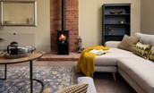 Willow Cottage - the stylish wood burner is the focal point of the sitting room