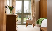 East Lodge - the floor length windows in the bedrooms overlook the sunny terrace and the countryside beyond